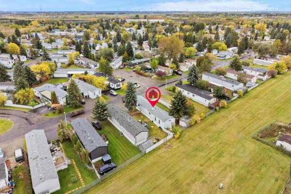 Elevated aerial view of 52 Evergreen Park NW, Edmonton, showcasing the surrounding neighborhood and landscape. - 52 Evergreen Park Nw, Edmonton
