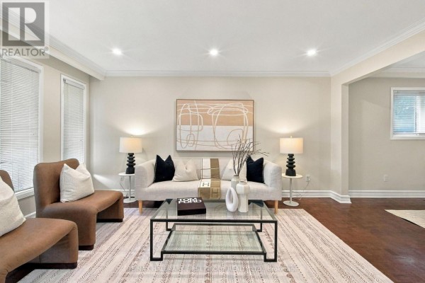 Interior hallway with tile flooring, console table, and large windows. - 520 Mcleod Crescent, Pickering