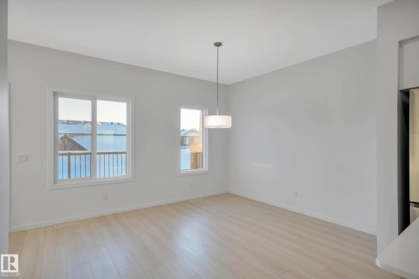 Family room - 5239 - 5245 21a Av Sw Sw, Edmonton, AB T6X1X5 Photo 4