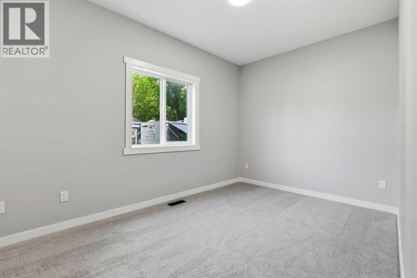 Bedroom - 5240 & 5242 51 Street, Lacombe, AB T4L1H7 Photo 3