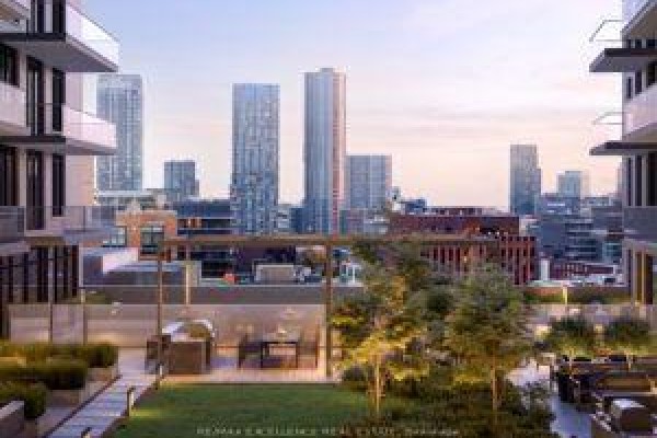 Rooftop terrace with patio furniture and cityscape views of tall buildings. - 526 - 543 Richmond Street W, Toronto