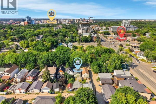 Aerial drone shot showing the 526 7th Street E property location and surrounding Saskatoon cityscape. - 526 7th Street E, Saskatoon