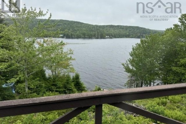 View of Indian Harbour Lake from the deck with surrounding green trees. - 528 West Side Indian Harbour Lake Road, Indian Harbour Lake
