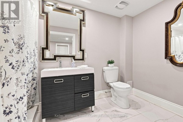 Modern bathroom vanity, mirror, and toilet with floral shower curtain - 53 - 145 Aberfoyle Mill Crescent Puslinch