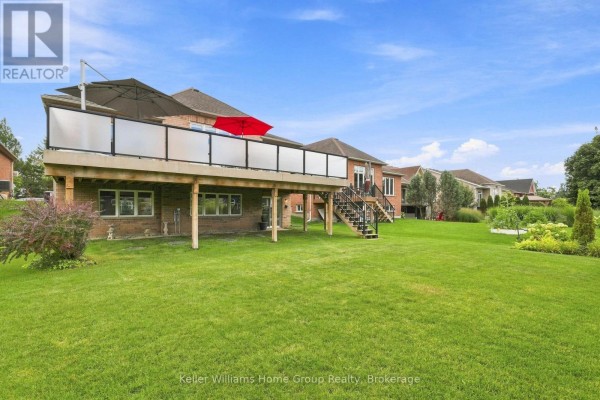 Spacious backyard with deck, walk-out basement, and landscaped garden - 53 - 145 Aberfoyle Mill Crescent Puslinch
