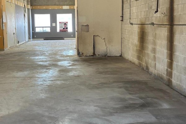 View of a partially finished commercial space with concrete floors and exposed interior walls. - 53 - 173 Advance Boulevard, Brampton