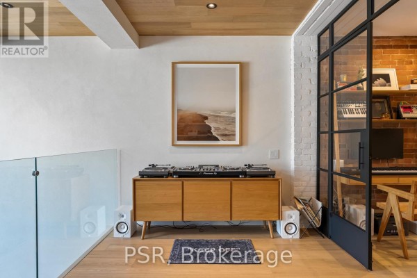DJ setup, artwork, and glass door - 53 Palmerston Avenue Toronto