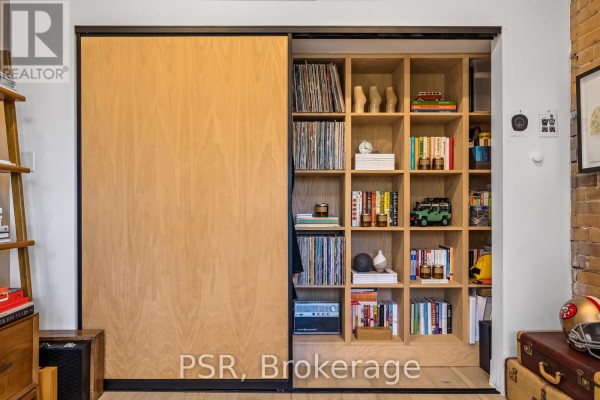 Custom wood shelving unit with records & books - 53 Palmerston Avenue Toronto