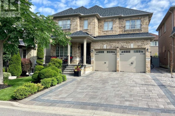 Two-story detached brick house with a double garage and a well-maintained lawn and garden. - 53 Trinita Avenue, Vaughan
