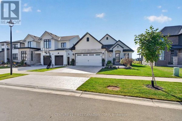 Street view of a newly built luxury home with a clean facade and manicured lawn. - 53 Wayside Lane, Southwold