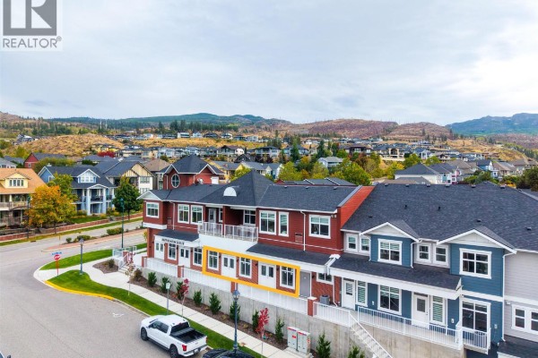 Aerial view of a multi-unit commercial and residential building with a highlighted ground floor commercial space. - 5300 Main Street Unit# 40 & 50, Kelowna