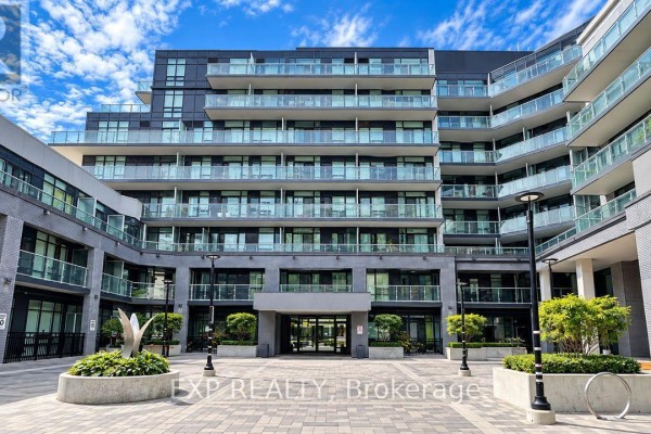 Courtyard view of a condo building with balconies and glass railings. - 532 - 621 Sheppard Avenue E, Toronto