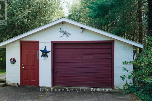 Detached garage with red door, burgundy garage door, dragonfly decor - 536 Alfred Street Huron Kinloss