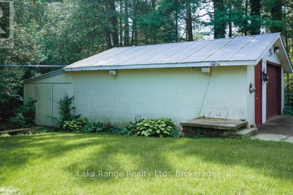 Garage with metal roof, double garage door, and side door - 536 Alfred Street Huron Kinloss