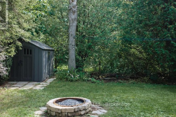Backyard with shed, fire pit, patio, and lawn - 536 Alfred Street Huron Kinloss
