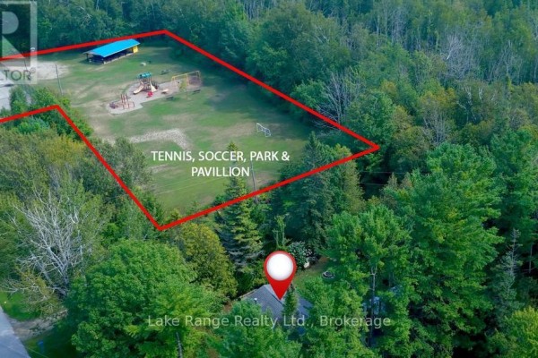 Aerial view of the property showing a detached garage, surrounded by trees, with a park and playground nearby. - 536 Alfred Street, Huron Kinloss