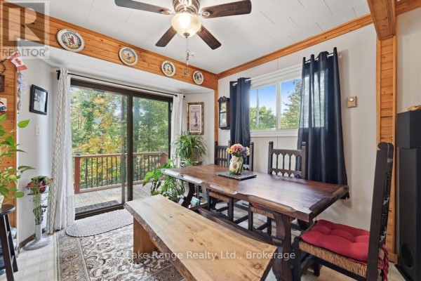 Live-edge dining table and bench with rustic chairs, deck access - 536 Alfred Street Huron Kinloss