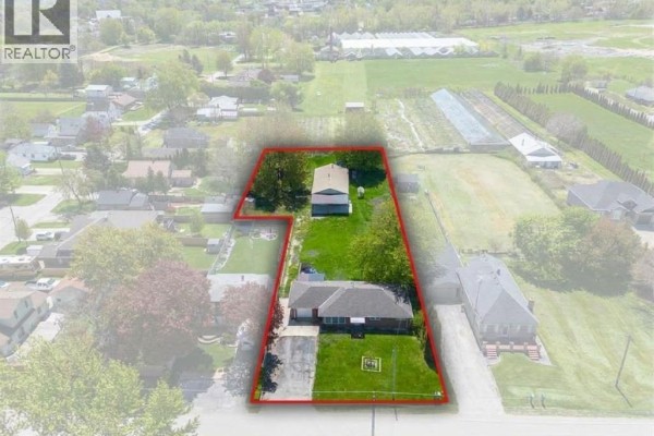 Aerial view of the property with a red outline showing the house, garage, and backyard. - 536 Mersea Rd 3, Leamington