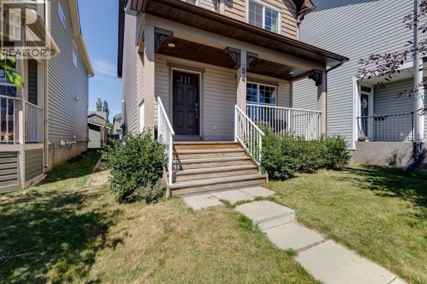 Close-up of the front porch steps and entrance to the house. - 54 Autumn View Se, Calgary