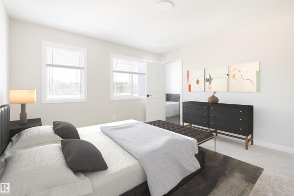 Bedroom with a king-size bed, dark dresser, bench, and large windows overlooking a wooded area. - 54 Cuddie Dr, Sherwood Park