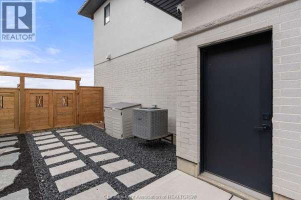 Privacy fence, stone pathway, and AC unit - 54 Dundee Drive West Chatham