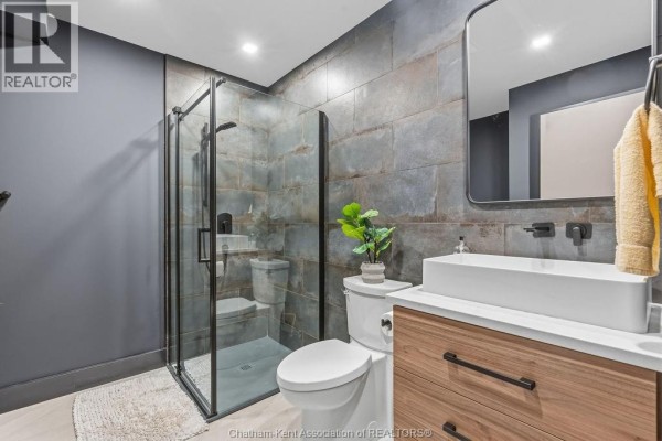Glass shower, vessel sink, wooden vanity - 54 Dundee Drive West Chatham