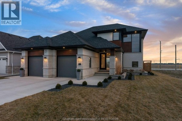 Modern home with dual garage, stone and wood facade - 54 Dundee Drive West Chatham