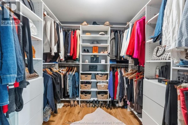 Walk-in closet with organized shelving and racks - 54 Dundee Drive West Chatham