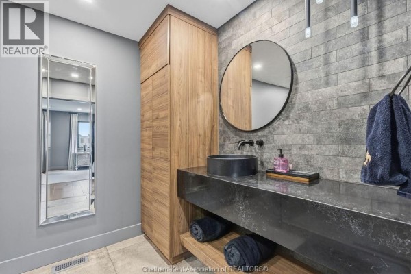 Modern bathroom with vessel sink, wood cabinet, and floating vanity - 54 Dundee Drive West Chatham