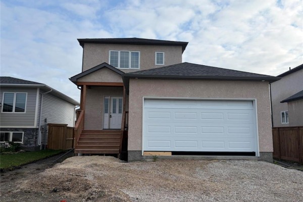 Side exterior view of the house showing a garage door and an attached dwelling. - 54 Feathertail Way, New Bothwell