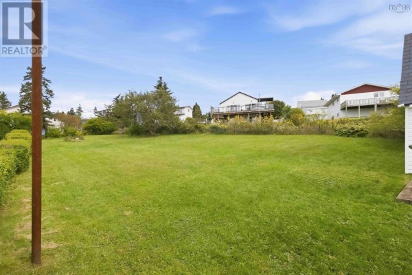 A light yellow highlighted lot with property lines and adjacent house numbers on a map. - 54 Himmelman Drive, Eastern Passage