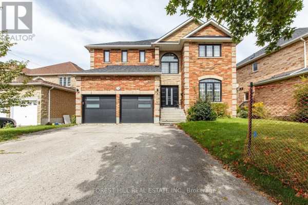 Front exterior of a red brick house with stone accents and a double garage. - 54 Maple Grove Avenue, Richmond Hill