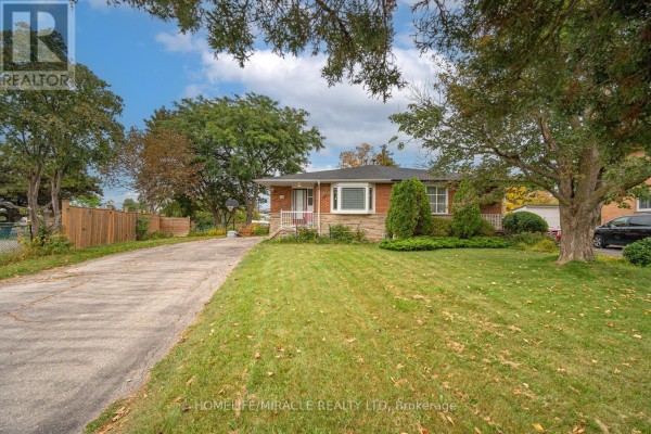 Front view of a bungalow with a sloped lawn, mature tree, and driveway. - 54 Sunderland Crescent, Toronto