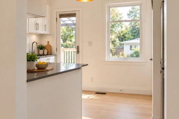 Hallway with pale pink walls, a beige door with glass panels, and a patterned runner. - 54 Thyra Avenue, Toronto