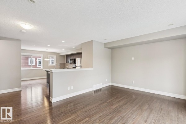Patio area with snow, grill, and view of street - 5409 3 Av Sw, Edmonton
