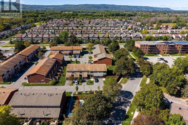 Aerial view of a townhouse complex with brick buildings and surrounding residential areas. - 541 Tenth Street, Collingwood