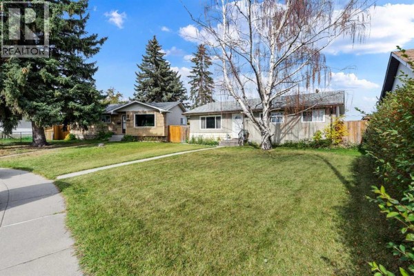 View of the street showing the house at 5410 Valentine Crescent SE and neighbouring properties. - 5410 Valentine Crescent Se, Calgary