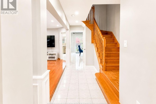 Wooden staircase and tiled hallway - 5456 Palmerston Crescent Mississauga