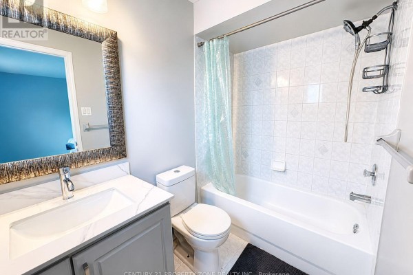 Gray vanity, marble counter, decorative mirror & tub - 5456 Palmerston Crescent Mississauga