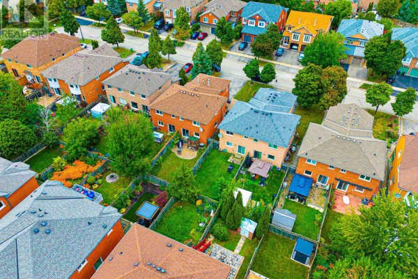 Aerial view of suburban houses with fenced backyards, patios, and gardens - 5456 Palmerston Crescent Mississauga