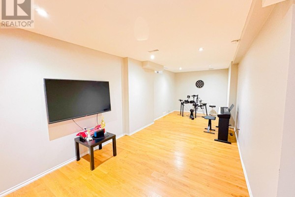 Basement living area with TV, drum kit, and keyboard - 5456 Palmerston Crescent Mississauga