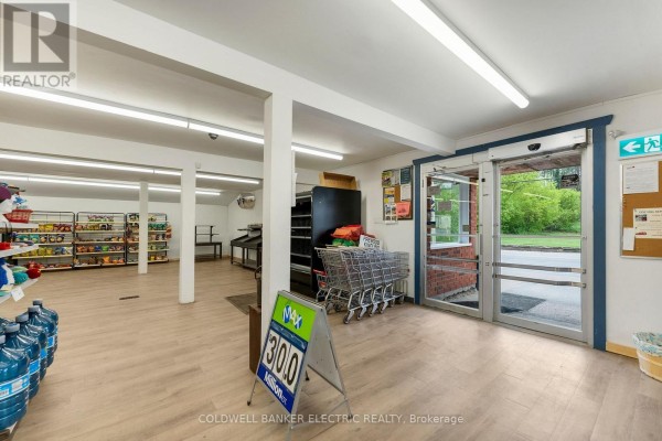Interior of a store showing aisles of products, shopping carts, and entrance doors. - 5480 Highway 620, Bancroft