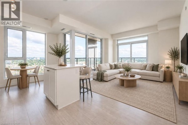 Open concept living and dining area with a sectional sofa, coffee table, and large windows. - 55 Duke Street Unit# 2102, Kitchener