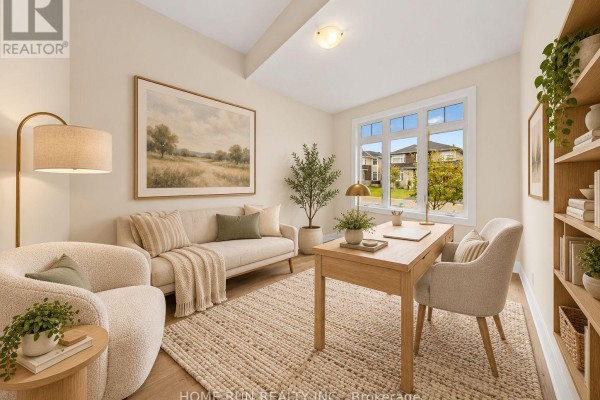 Home office with beige walls, textured rug, couch, wooden desk, and large window with a suburban view. - 55 Robertson Lane, Carleton Place