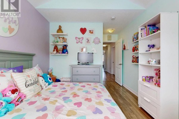 Child's bedroom with heart bedding, dresser, TV, and shelves - 55 Stocks Lane Aurora