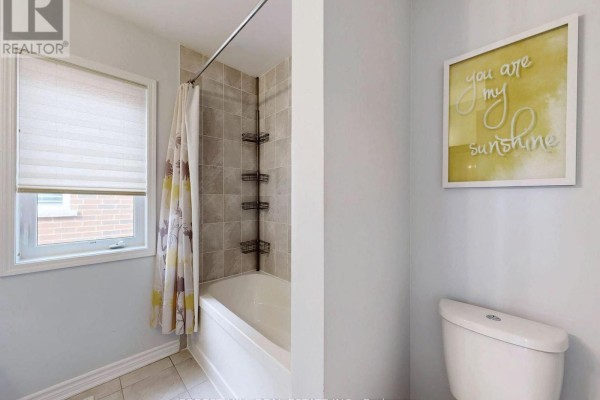Bathtub with shower curtain and toilet - 55 Stocks Lane Aurora
