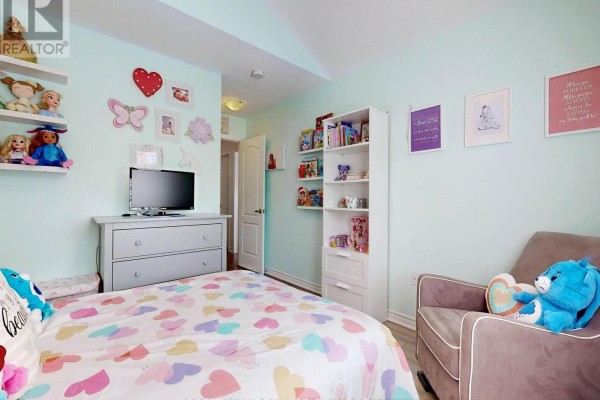 Child's bedroom with heart comforter, TV, bookshelf & armchair - 55 Stocks Lane Aurora