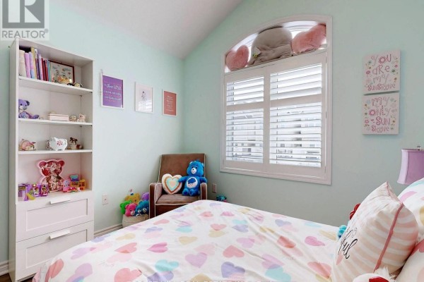 Bedroom with vaulted ceiling, arched window with shutters, bookshelf, and heart bedding - 55 Stocks Lane Aurora