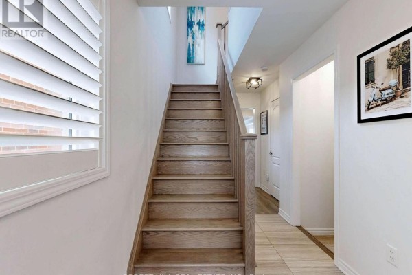 Wooden staircase and hallway with abstract art and plantation shutters - 55 Stocks Lane Aurora