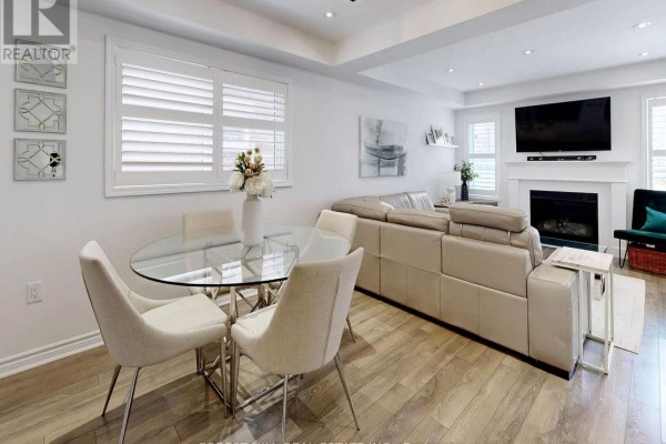 Glass dining table, sectional sofa, fireplace, mounted TV - 55 Stocks Lane Aurora